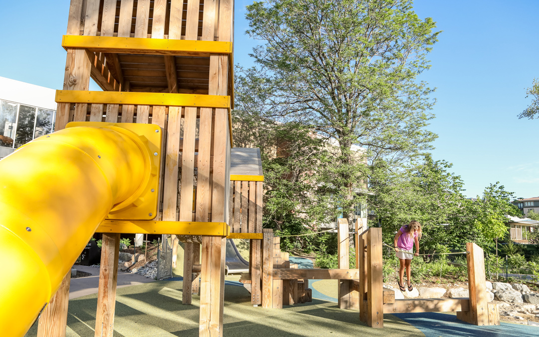 natural playground tower tube slide