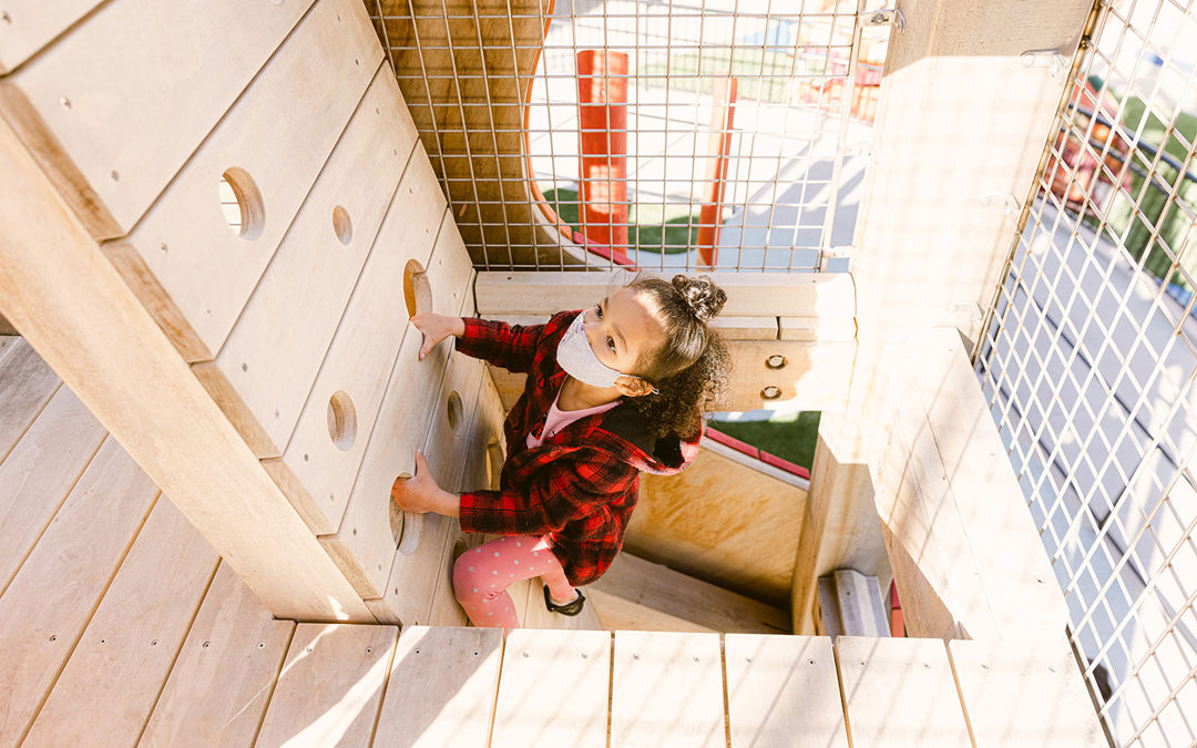 Girl climbs ladder inside playground tower at Willie Woo Woo Wong