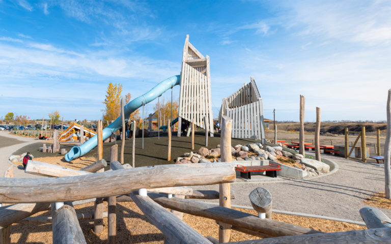 saskatoon saskatchewan natural wood playground log climber towers and tube slide