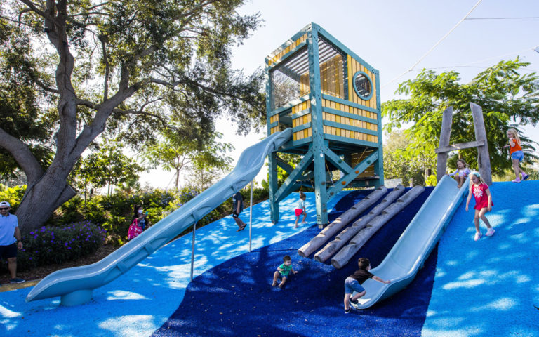 lifeguard themed marine tower slide notched logs climbing Florida destination playground