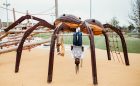 wolf spider sculpture with kids at scissortail park in oklahoma city