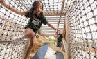 Wood bridge and flexform hangout climber playground equipment.
