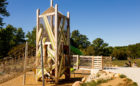 Playground tower with accessible wooden bridge at John Ball Zoo
