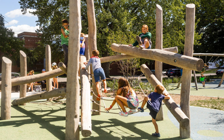 Children climb Log Jam at Grand Rapids, Michigan playground