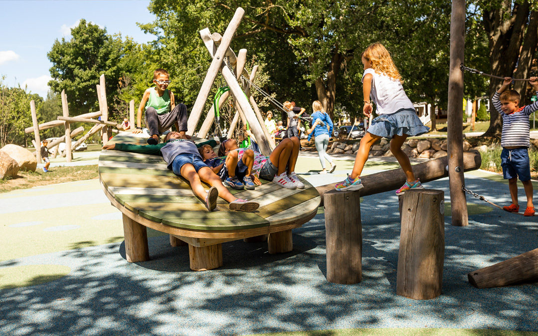 Children lie on leaf deck at John Ball Zoo playground