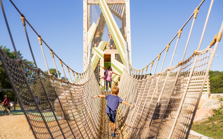 Net bridge leads to playground tower at John Ball Zoo playground