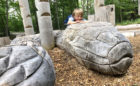 markham woodlot natural playground giant snake carving logs steppers