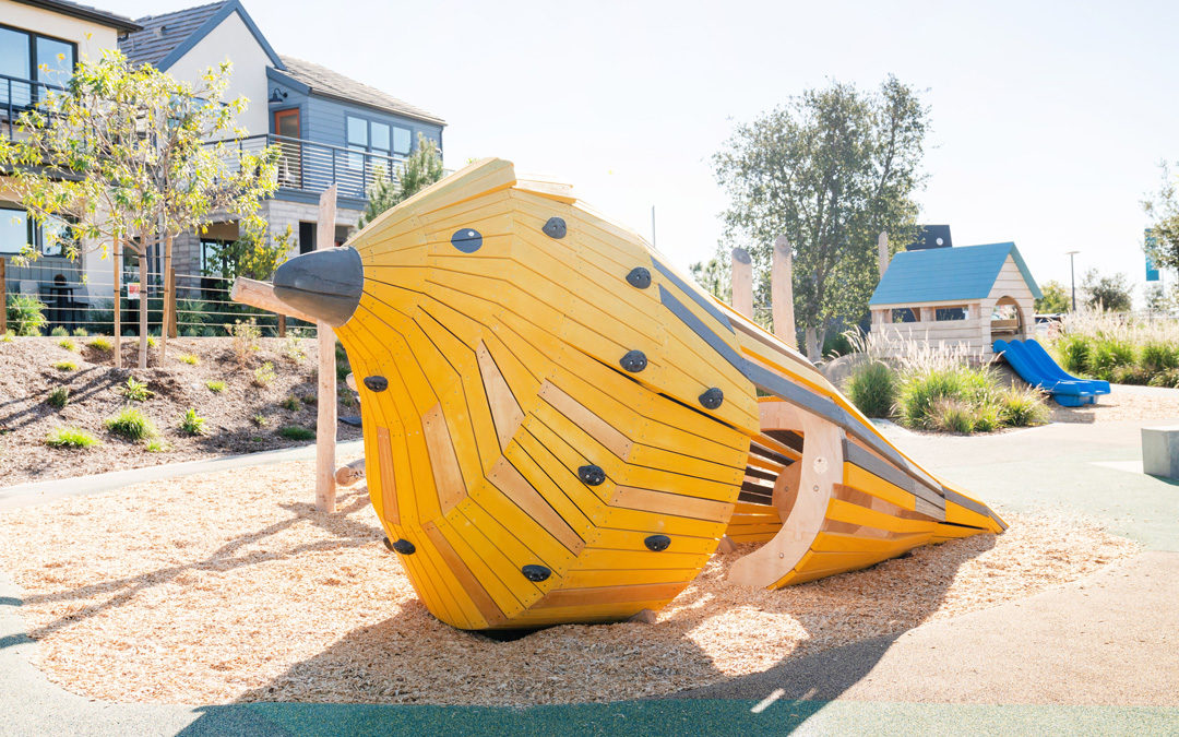 Overlook Park custom natural playground bird wood sculpture raised hut slide