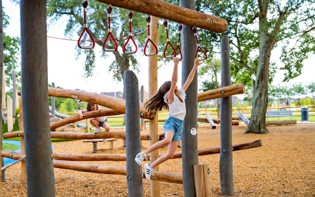 Amira Tomball Texas natural wood playground trapeze rings monkey bars robinia climber