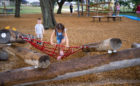 natural playground tomball texas oak log pile climber rope net