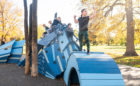 Denver playground blue dragon sculpture with kids at play