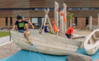 First Nations inspired canoe sculptures in child care playground