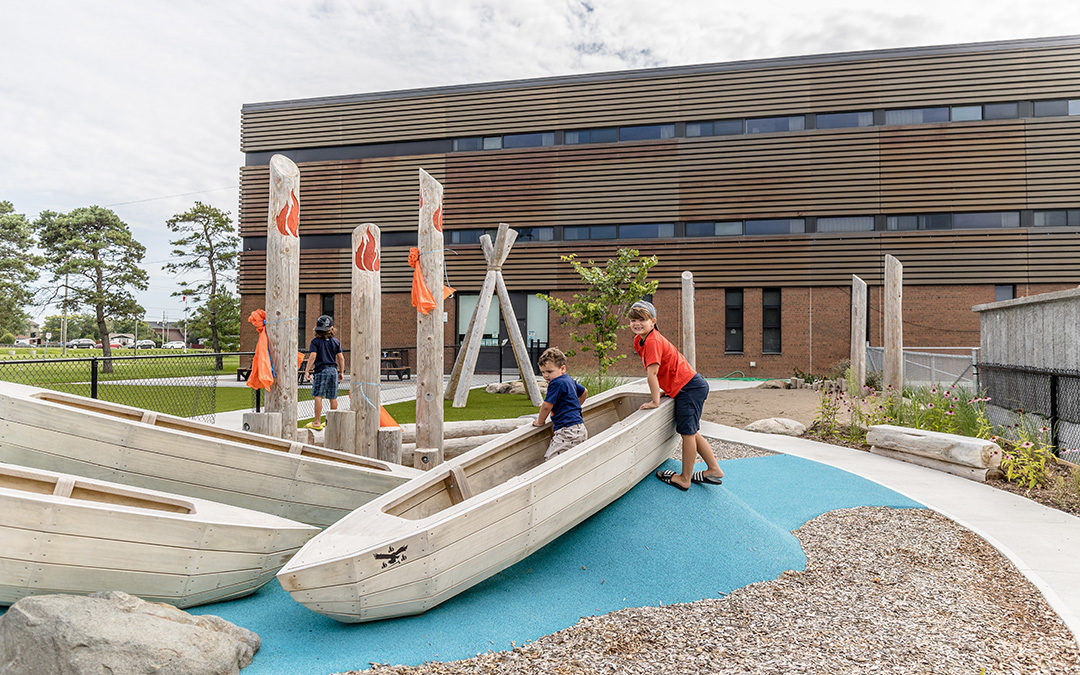 Boys play in canoe sculptures at Hagersville MCFN Early ON Centre