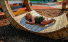 Kiwanis Park London natural playground passive play sculpture child resting
