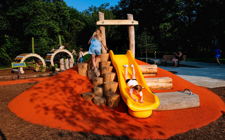 Kiwanis Park hill slide poured in place rubber surfacing natural playground