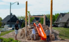 Natural playground with hill slide and log steppers