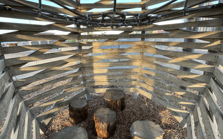 Presidio Oriole nest climbing structure with wood stepper seats added inside