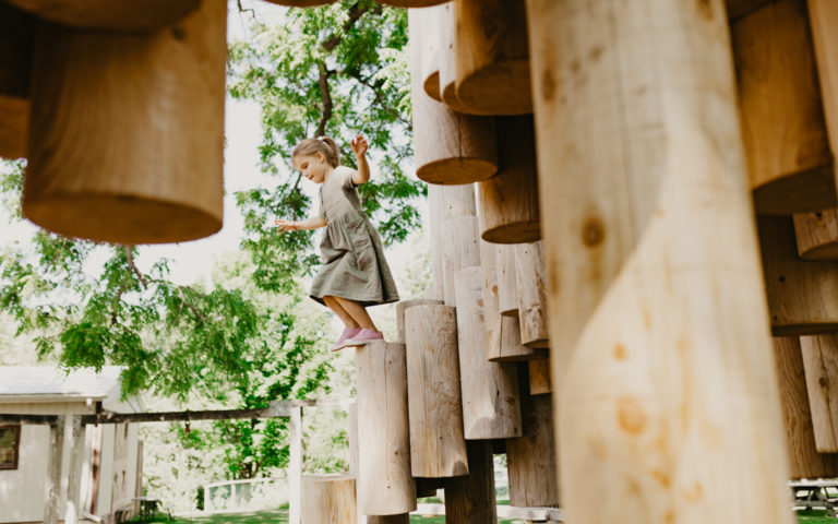 Girl jumps from Moku Yama by Kengo Kuma and Earthscape collaboration