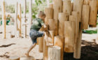 Boy climbs steppers of Kengo Kuma Earthscape Collections collaboration