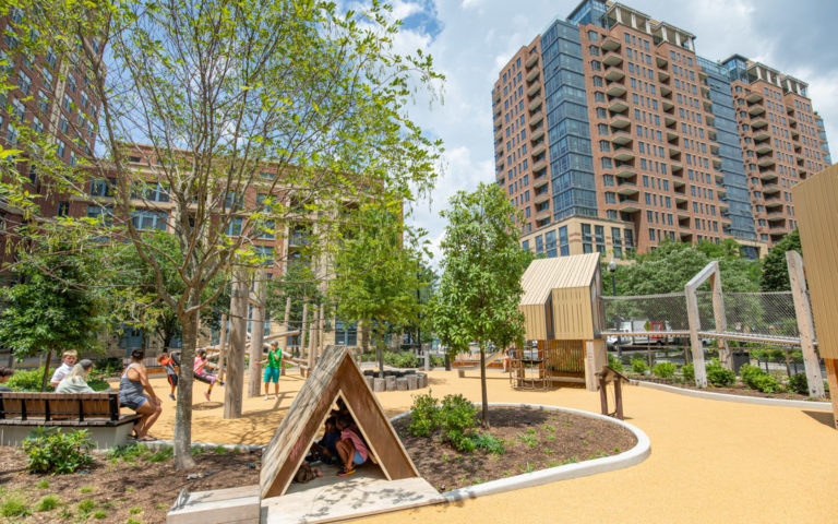 Arlington's Met Park playground with natural materials treehouse towers and bridge