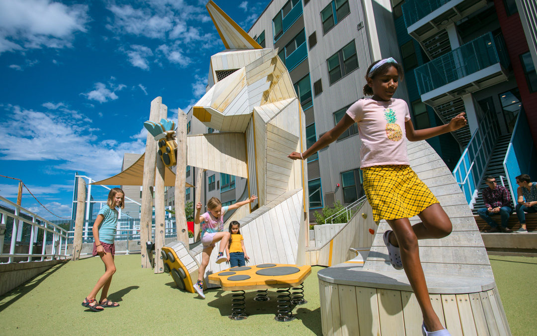 Children play on fox playground in Denver on rooftop Colorado