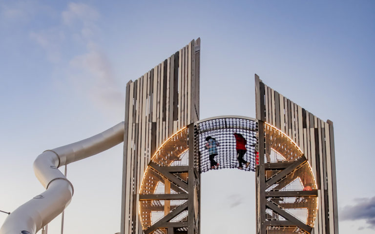 Playground towers by Earthscape Play with net bridge in Detroit